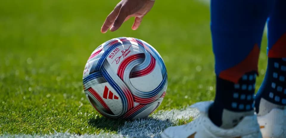 Player preparing to kick a soccer ball