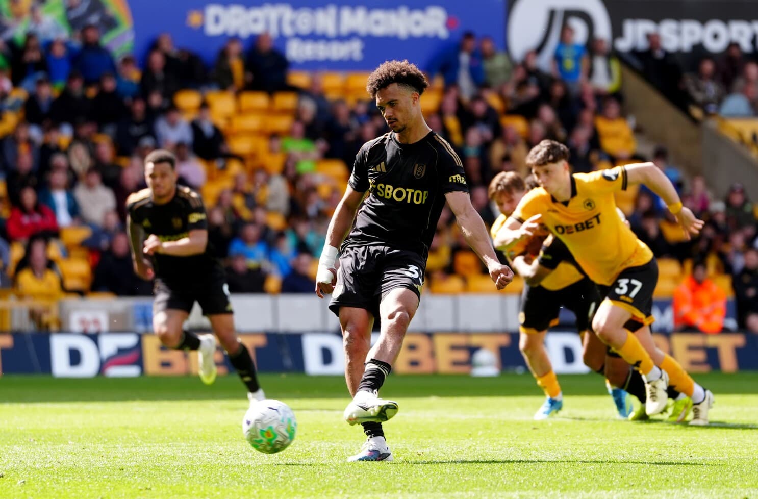 Player taking a penalty kick during match