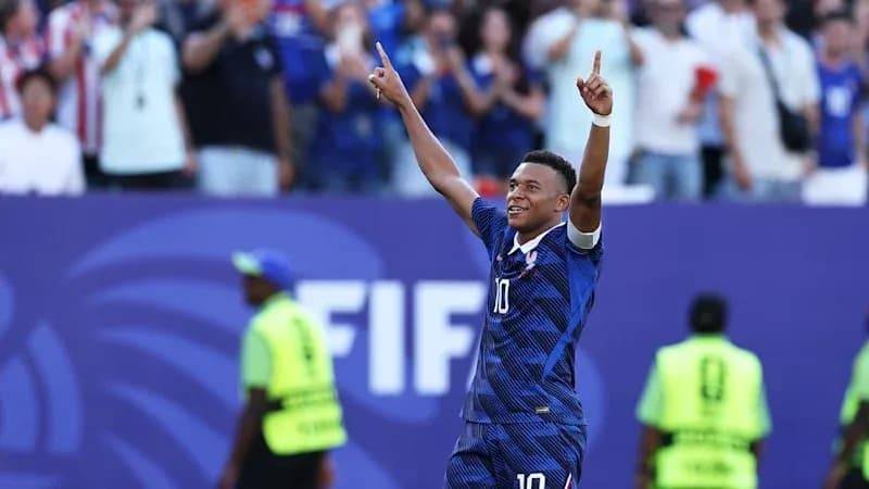 Player celebrating a goal with raised hands