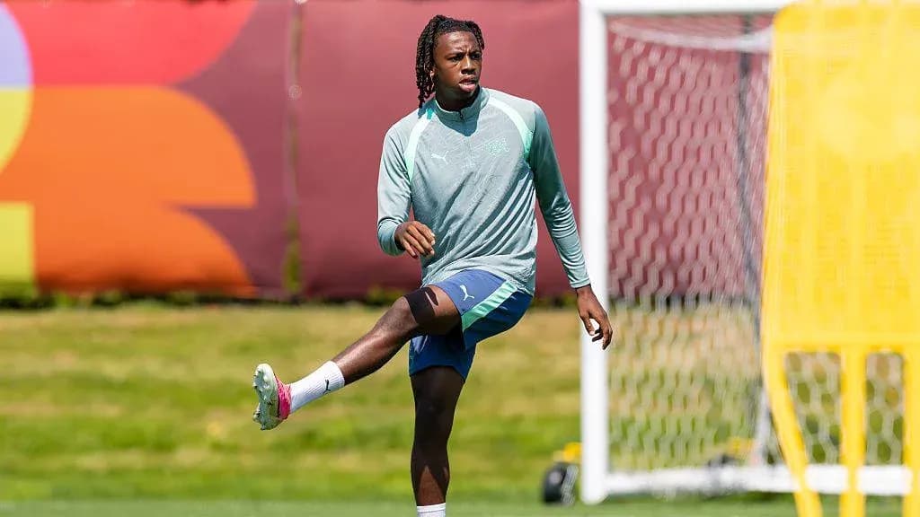 Player stretching leg during training session