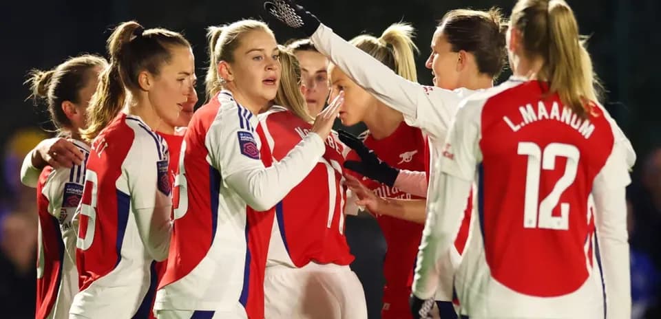 Arsenal W players celebrating during match