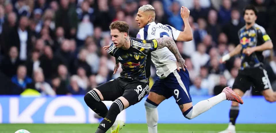 Leeds player tackled by Tottenham player