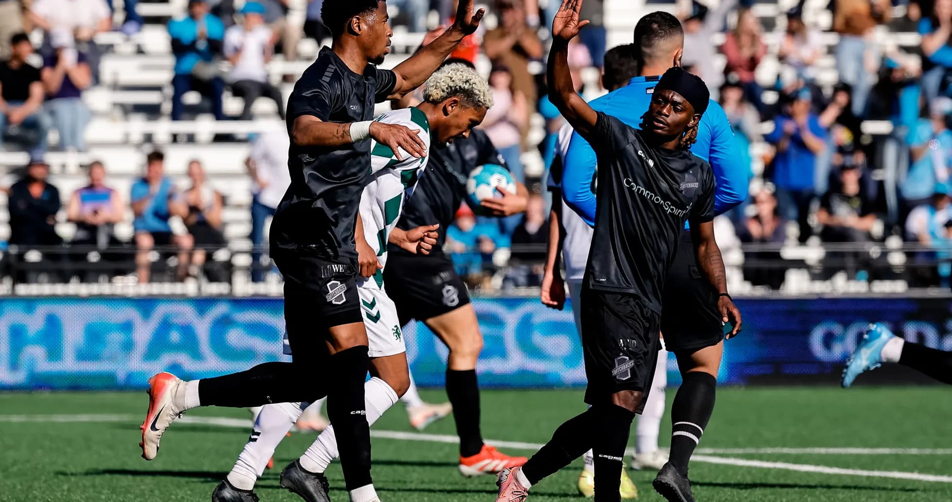 Players celebrating during Colorado Springs match