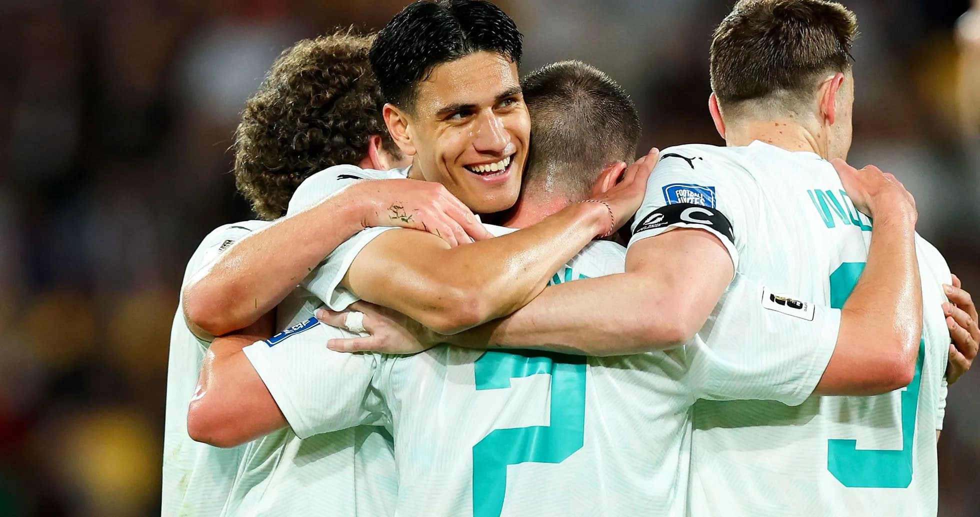 Players celebrating after scoring a goal