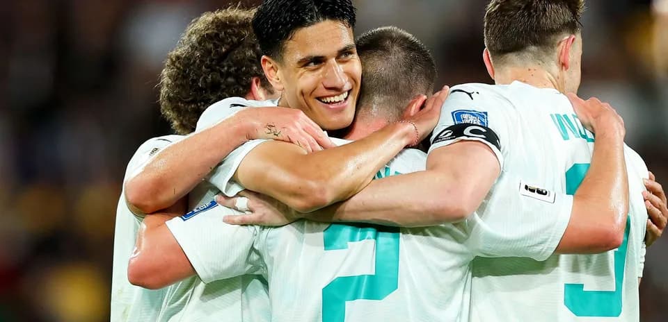 Players celebrating after scoring a goal