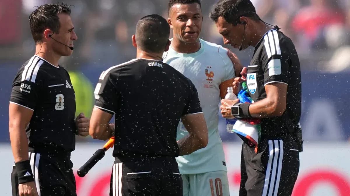 Referees discussing with player during match