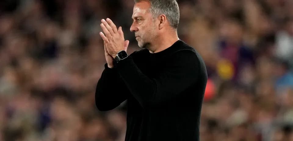 Coach applauding during a football match