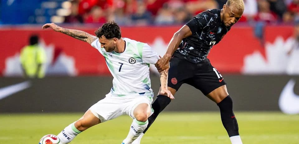 Two players competing for the ball during match