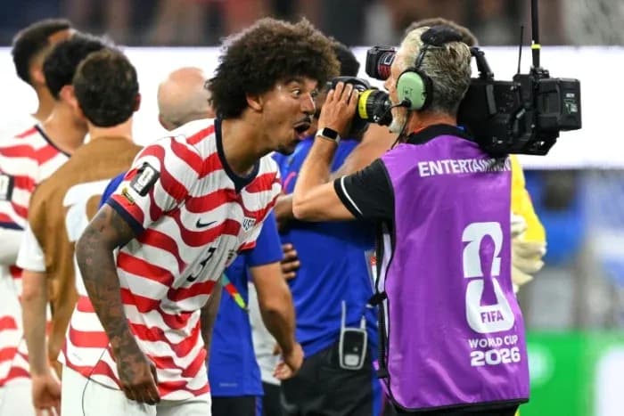 Player celebrating and speaking to camera after match