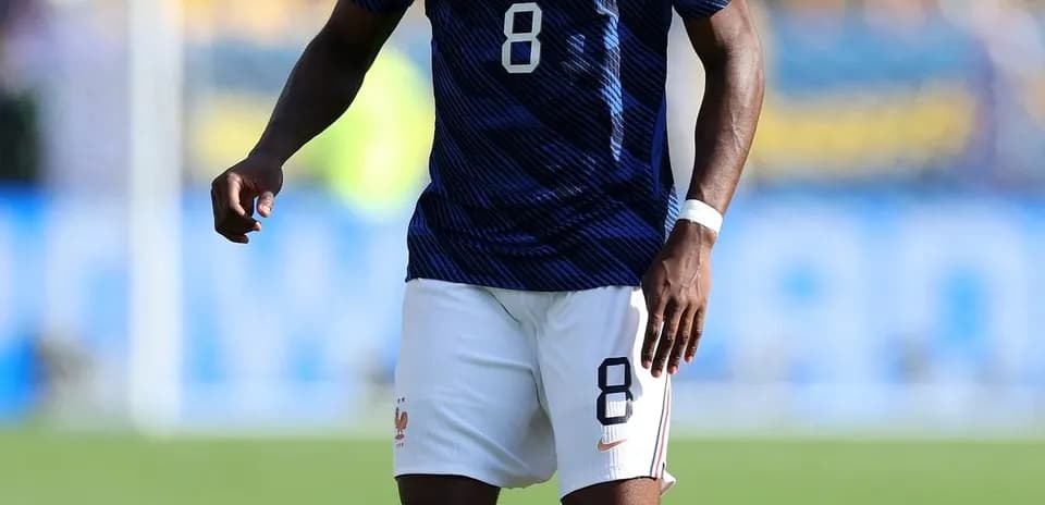 Player in blue France kit preparing for play
