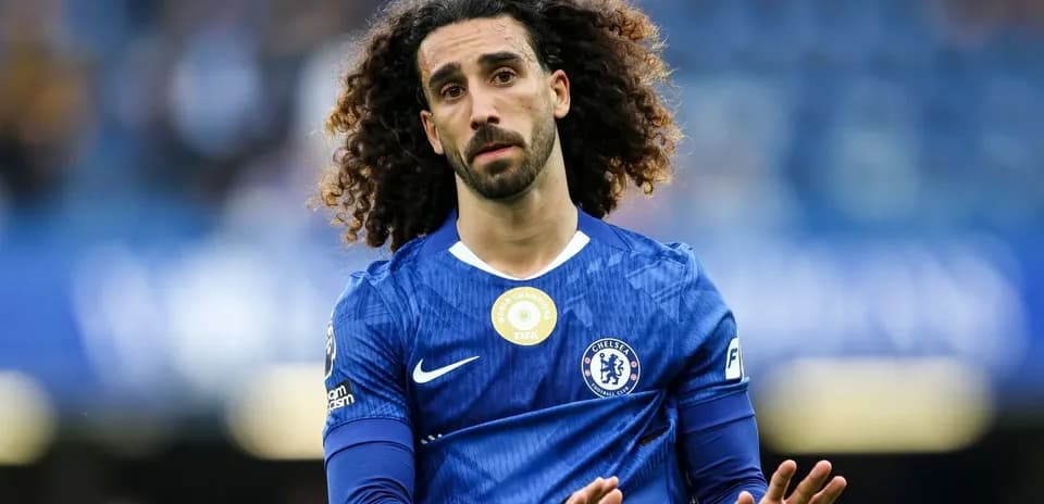 Chelsea player walking on the pitch in blue kit