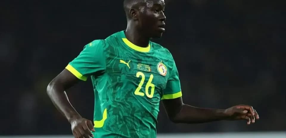 Senegal player wearing green jersey during match