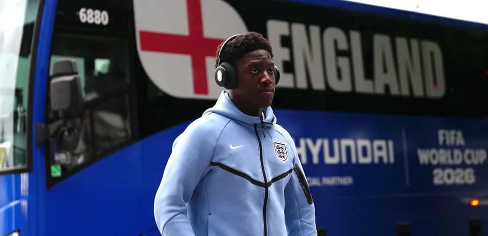 Player walking towards England team bus before match