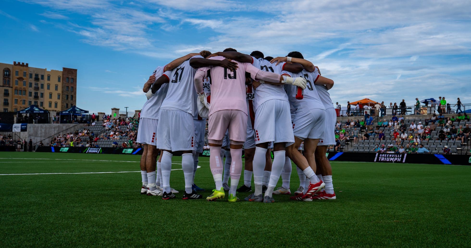 Greenville Triumph players huddling before the match