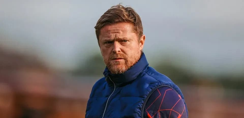 Coach observing training session on the field