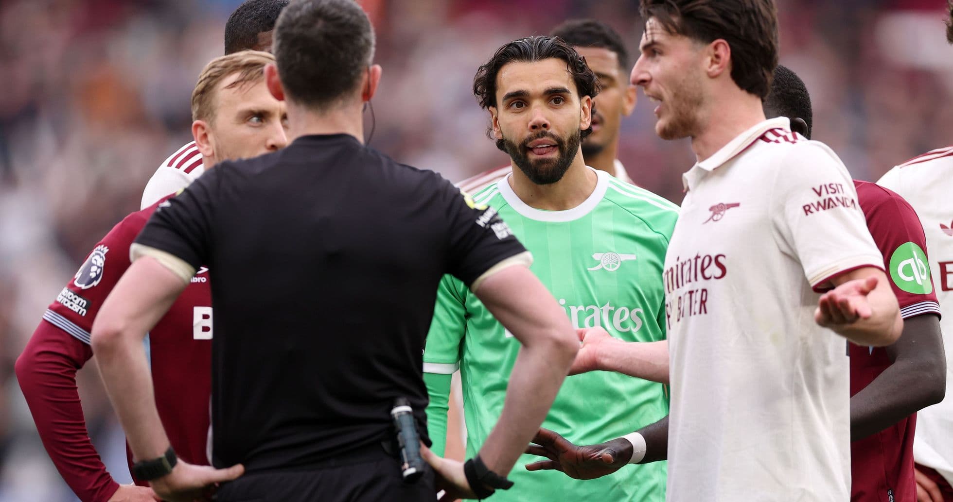 Players discussing with referee during match incident