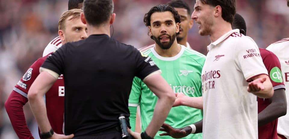 Players discussing with referee during match incident