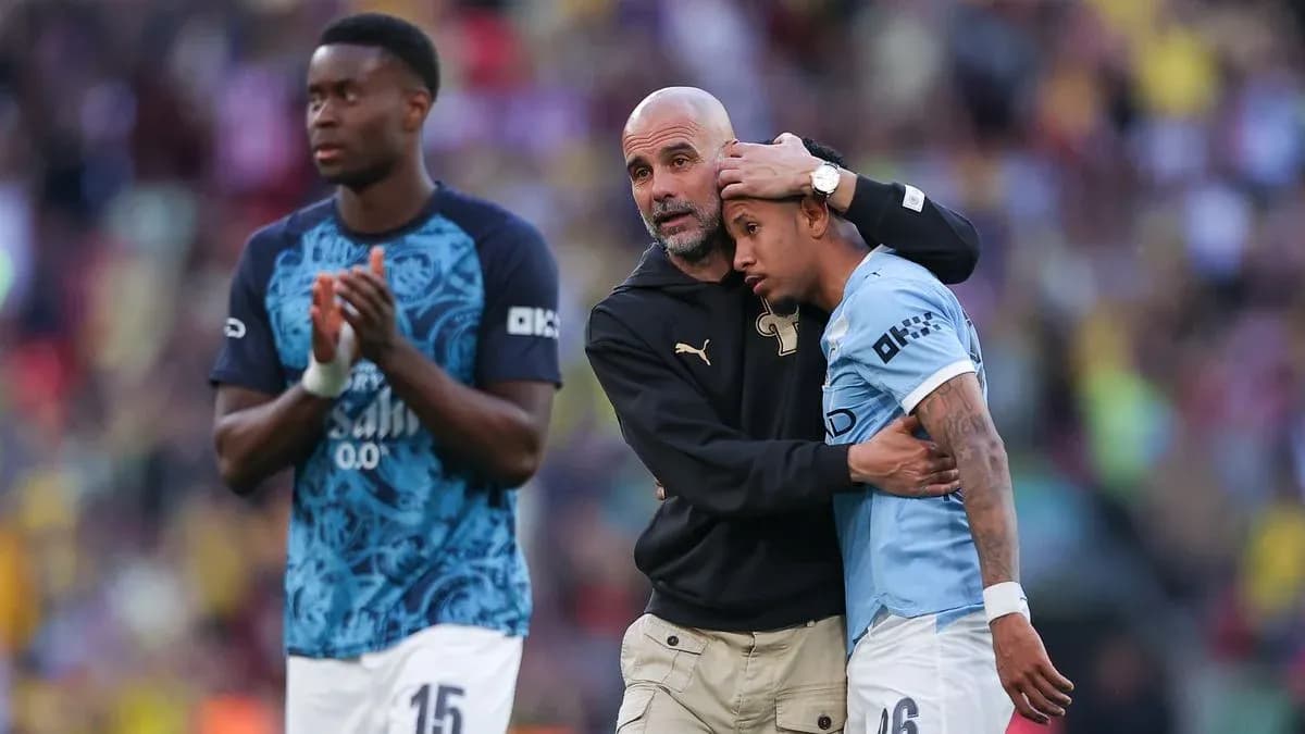 Coach comforting player after match on field