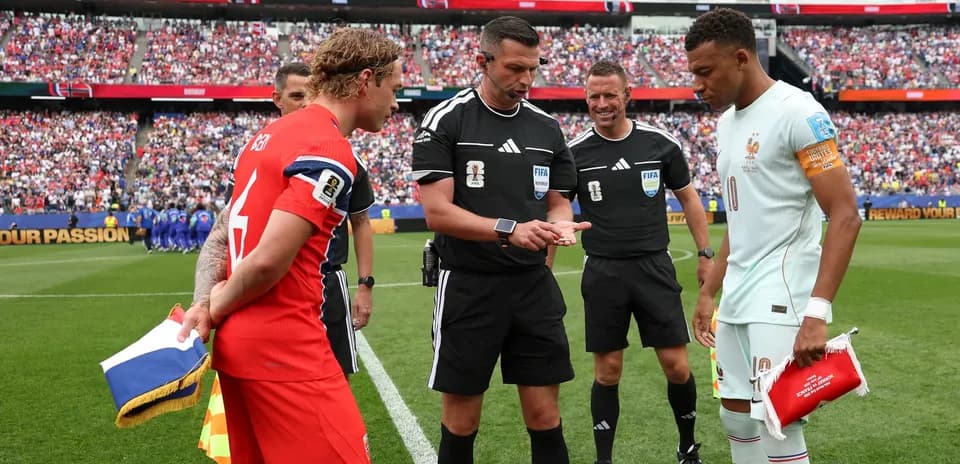 Team captains and referees at coin toss