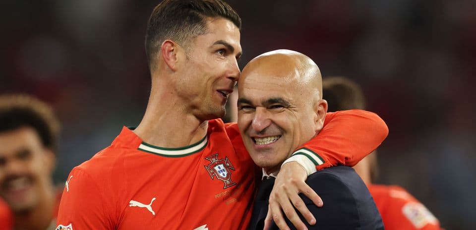 Cristiano Ronaldo embracing coach Roberto Martínez after match