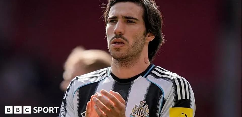 Player applauding in Newcastle United jersey