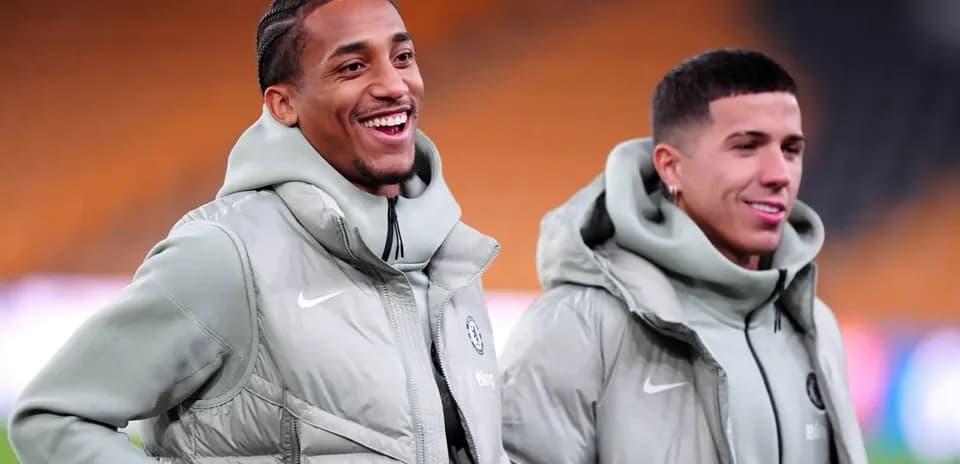 Two players smiling during warm-up before match