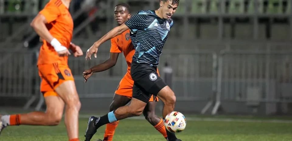 Tacoma Defiance player in action against Houston Dynamo FC II