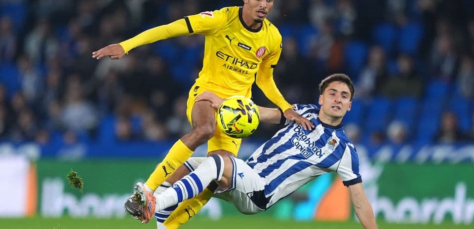 Player tackling during Girona vs Real Sociedad match