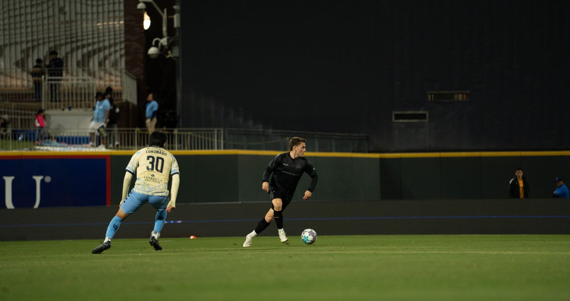 Player dribbling the ball during USL match