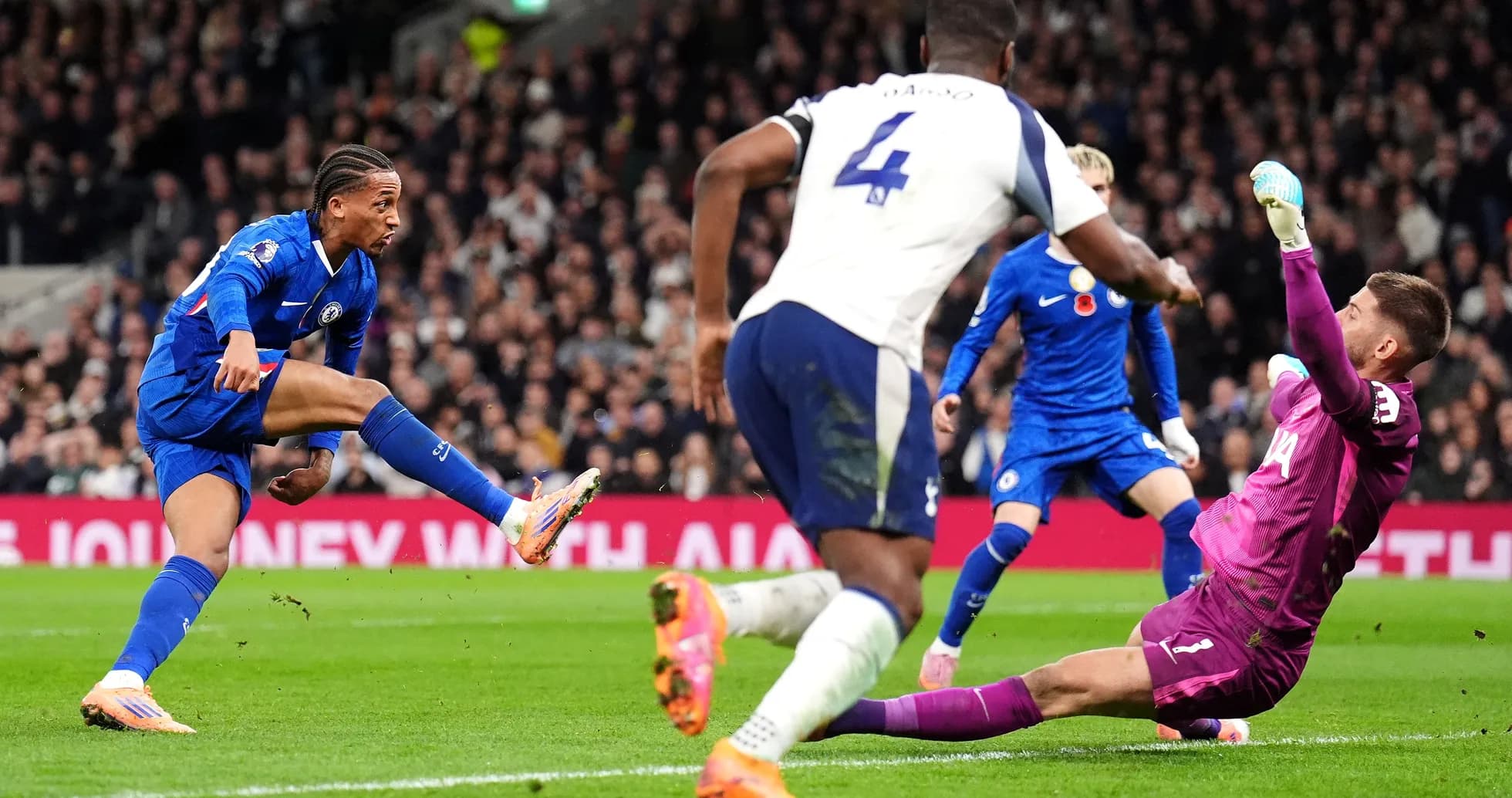 Chelsea player attempting to score against Tottenham