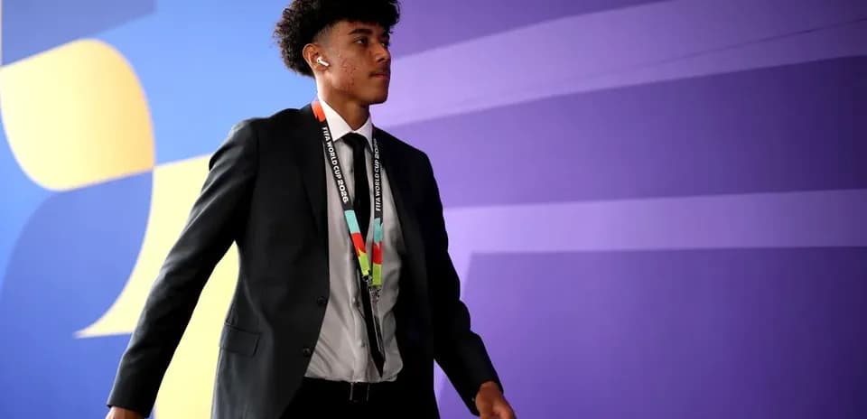 Player arriving at venue wearing a suit