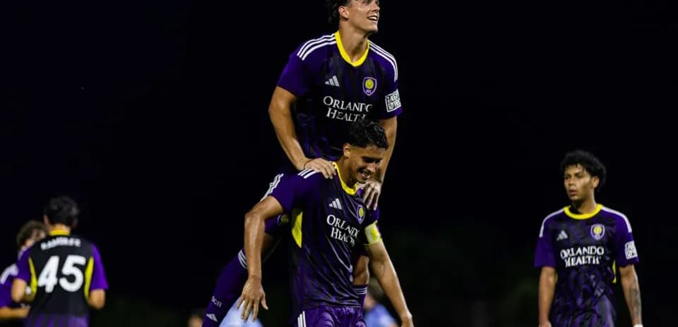Players celebrating during Orlando City II match