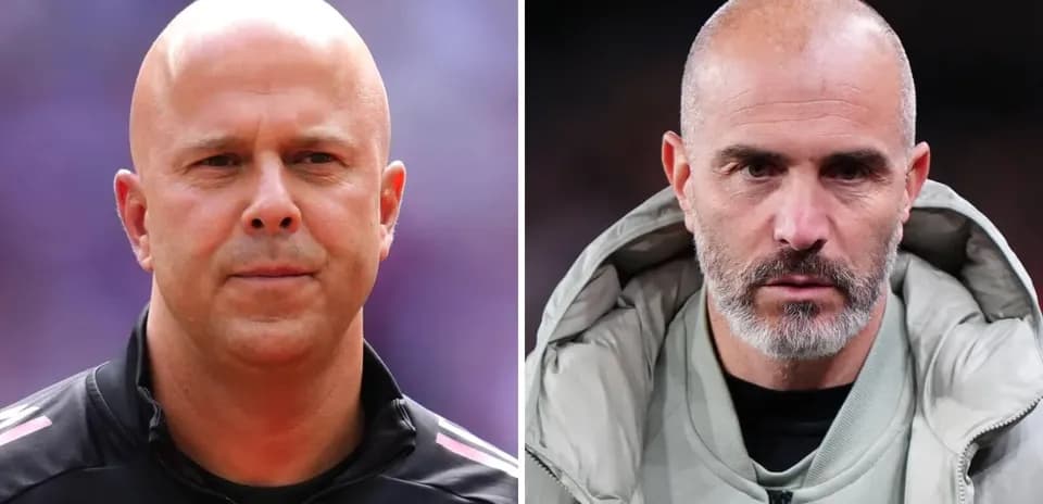 Two football coaches facing camera during match
