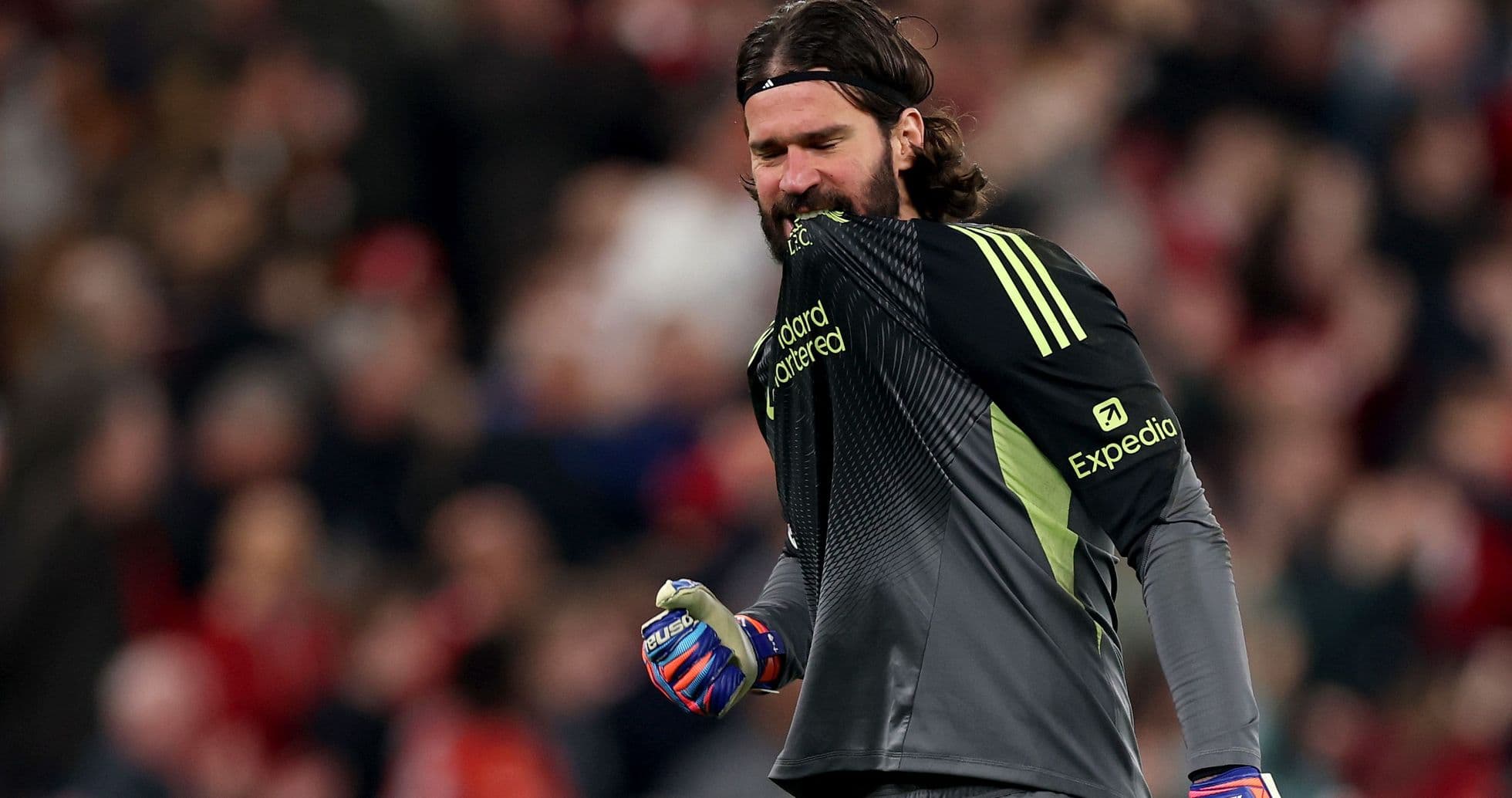 Goalkeeper celebrating in front of the crowd