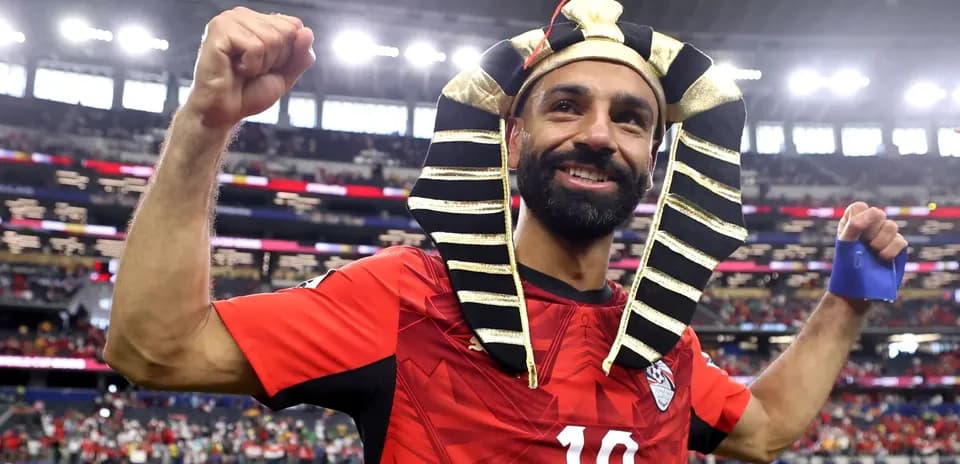 Player celebrating in Egyptian pharaoh costume after match