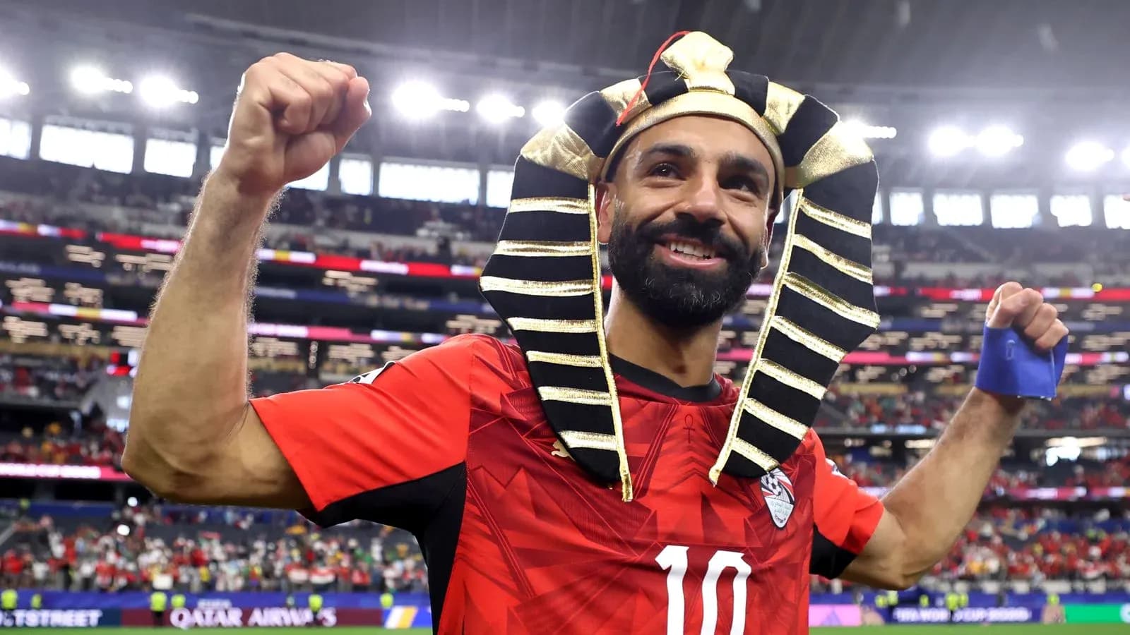 Player celebrating in Egyptian pharaoh costume after match