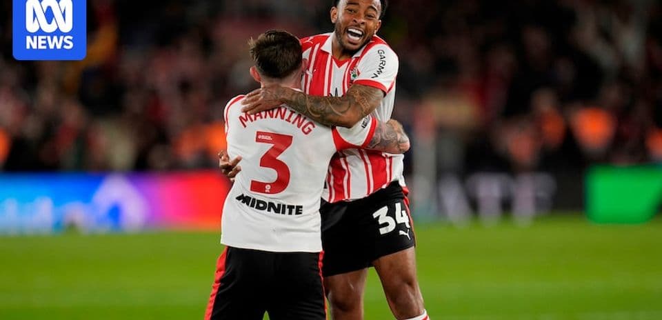 Two players celebrating together after a match
