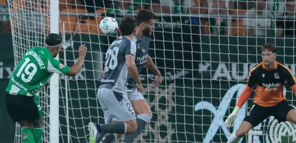 Player heading the ball towards the goal