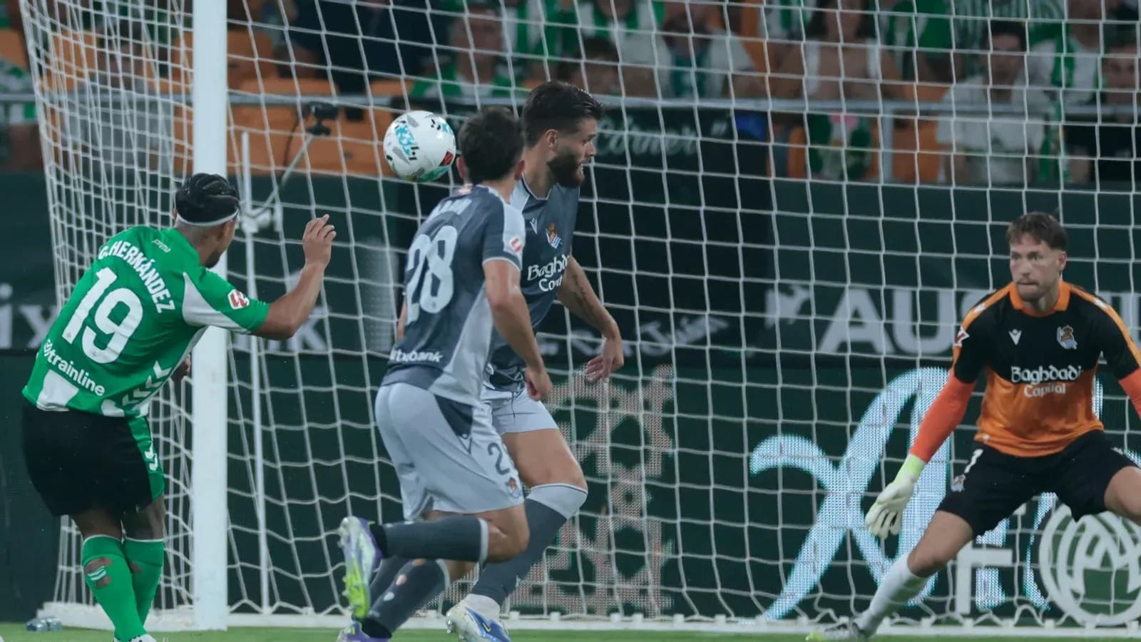 Player heading the ball towards the goal
