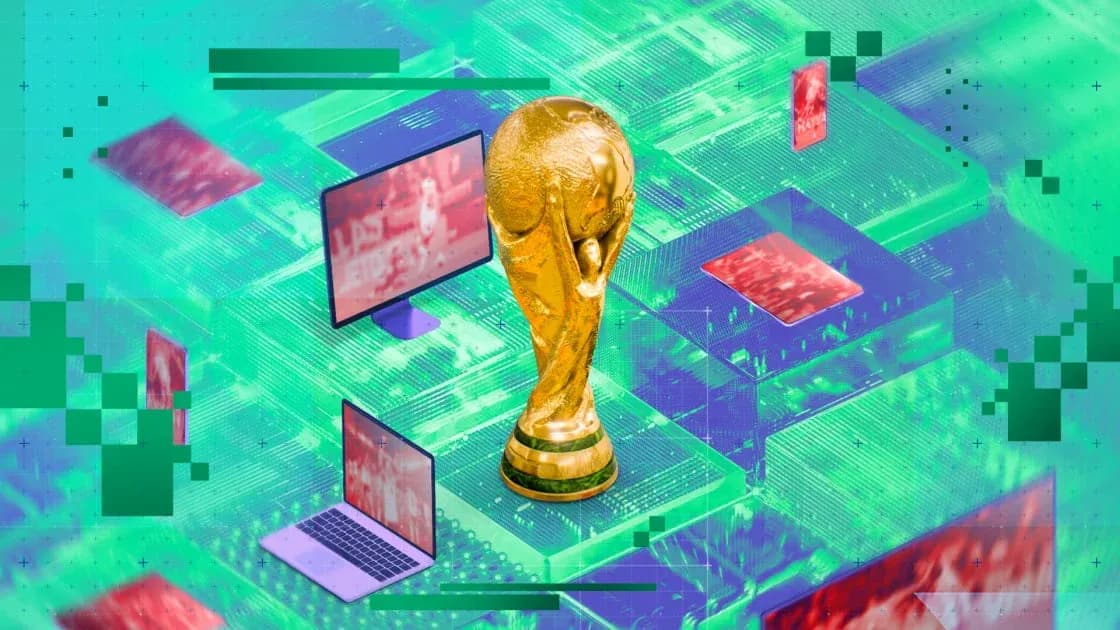 FIFA World Cup trophy with digital screens in background