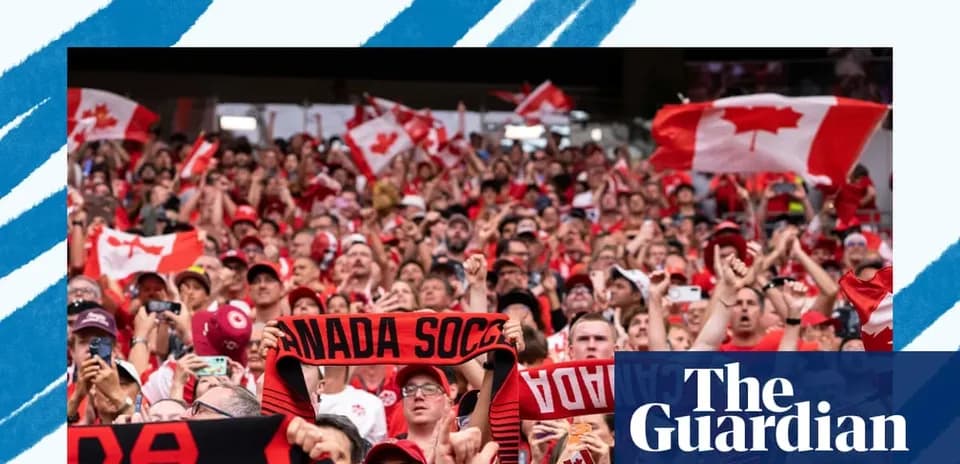 Crowd of fans waving Canadian flags at match