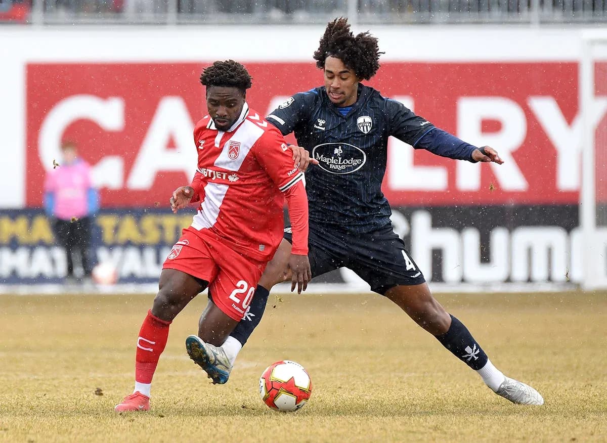 Players contesting for the ball during match