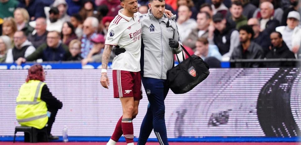 Player assisted off the field by medical staff
