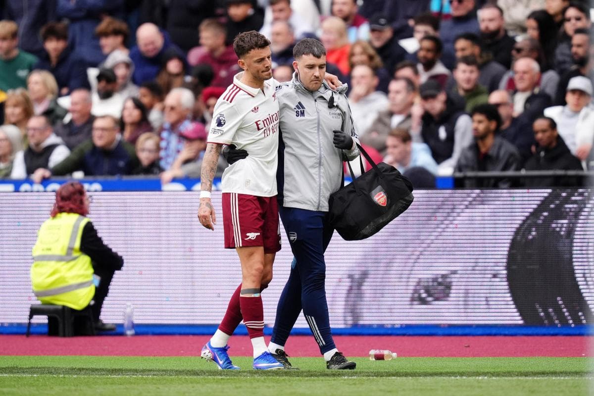 Player assisted off the field by medical staff