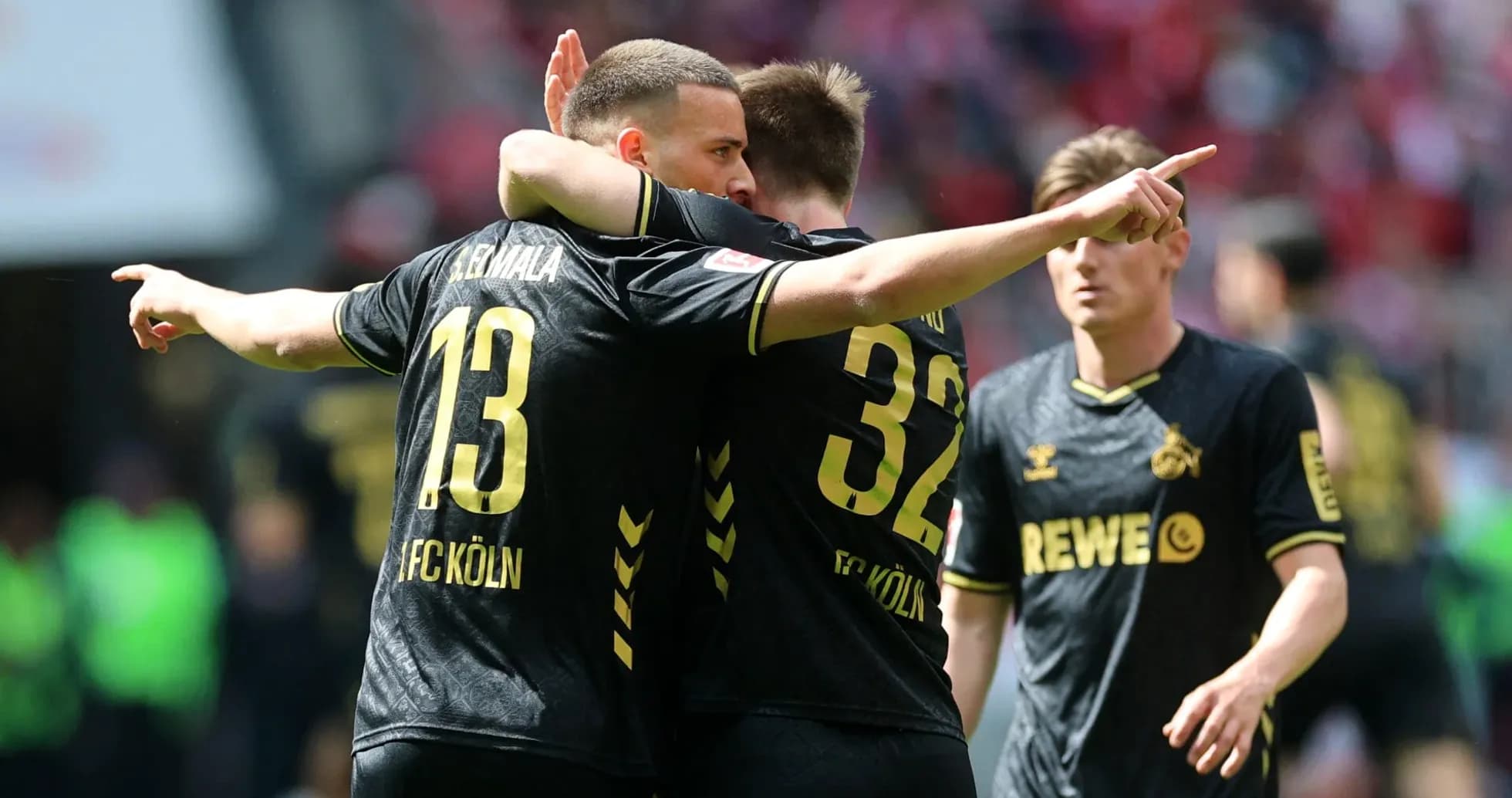 FC Köln players celebrating a goal on the field