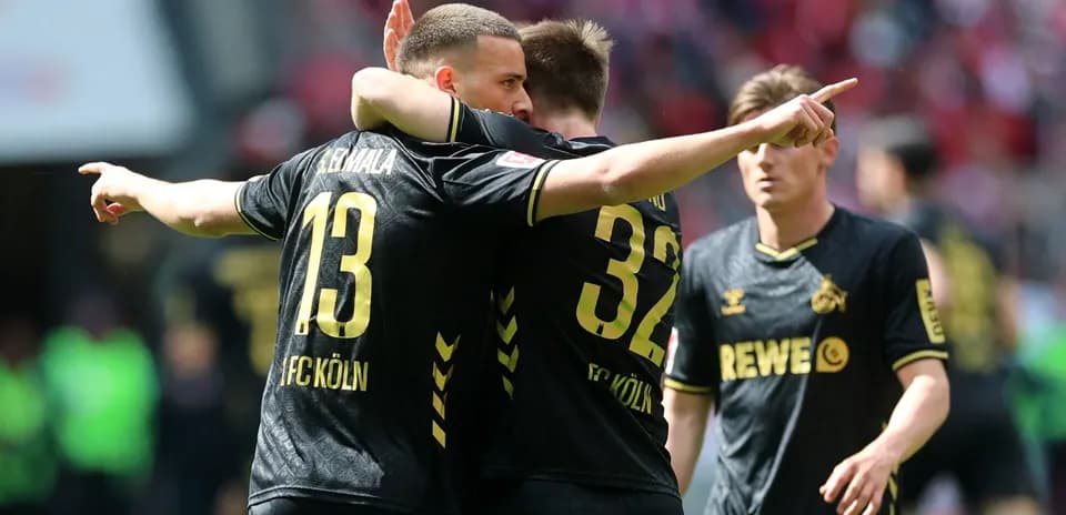 FC Köln players celebrating a goal on the field