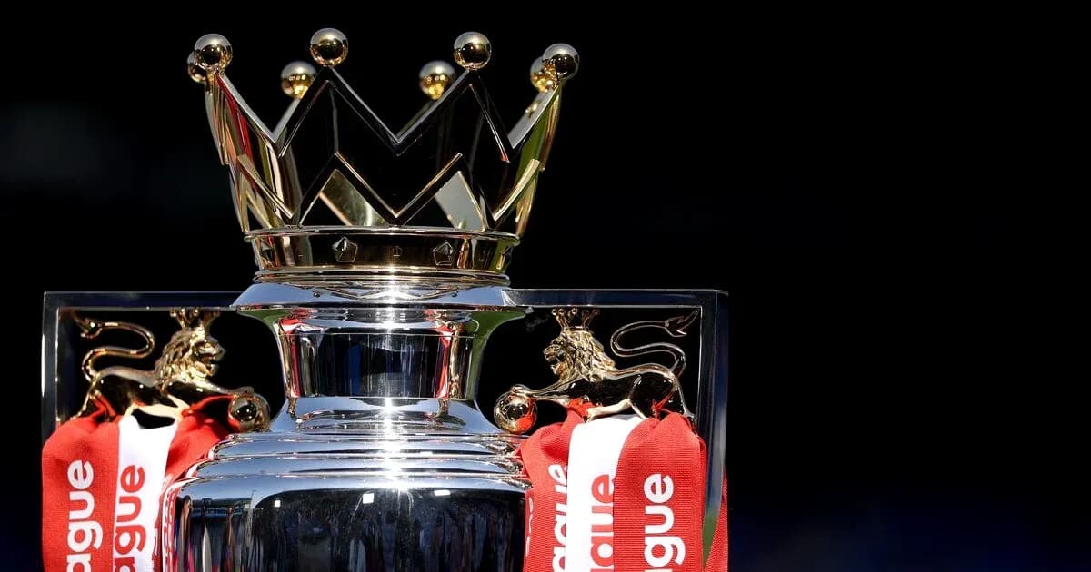 Premier League trophy with red ribbons and crown