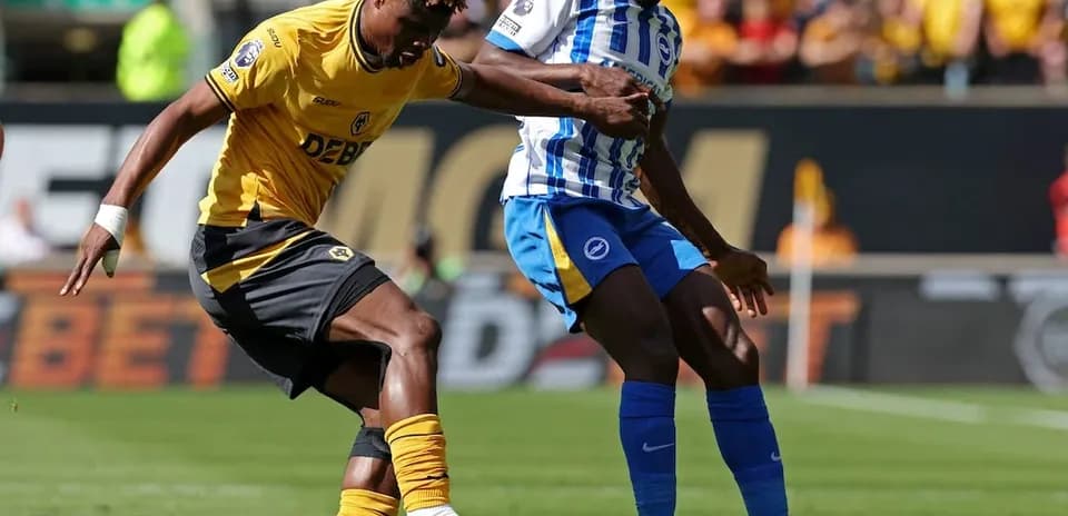 Player tackles during Brighton vs Wolves match