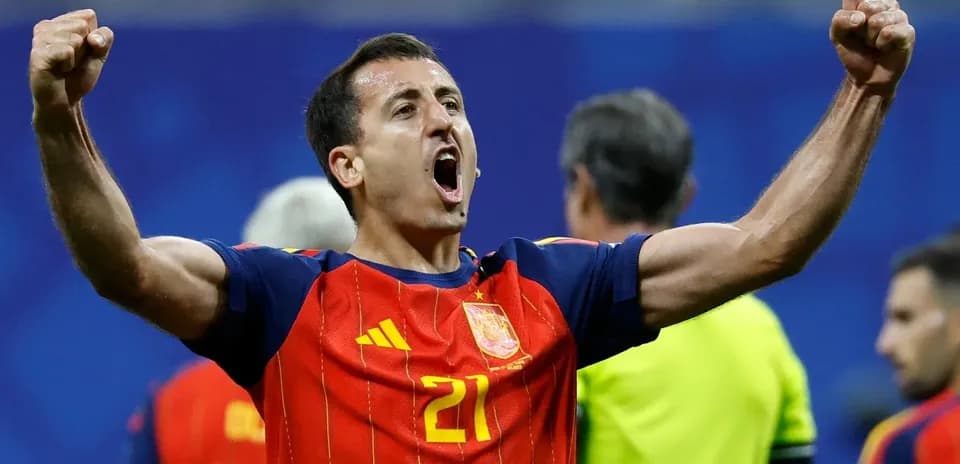 Player celebrating victory wearing Spain jersey
