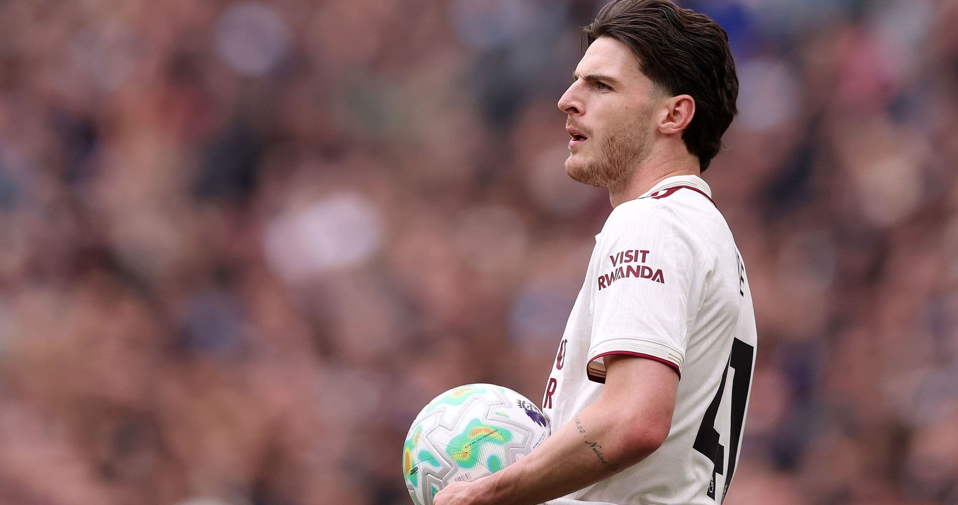 Player holding ball during match action